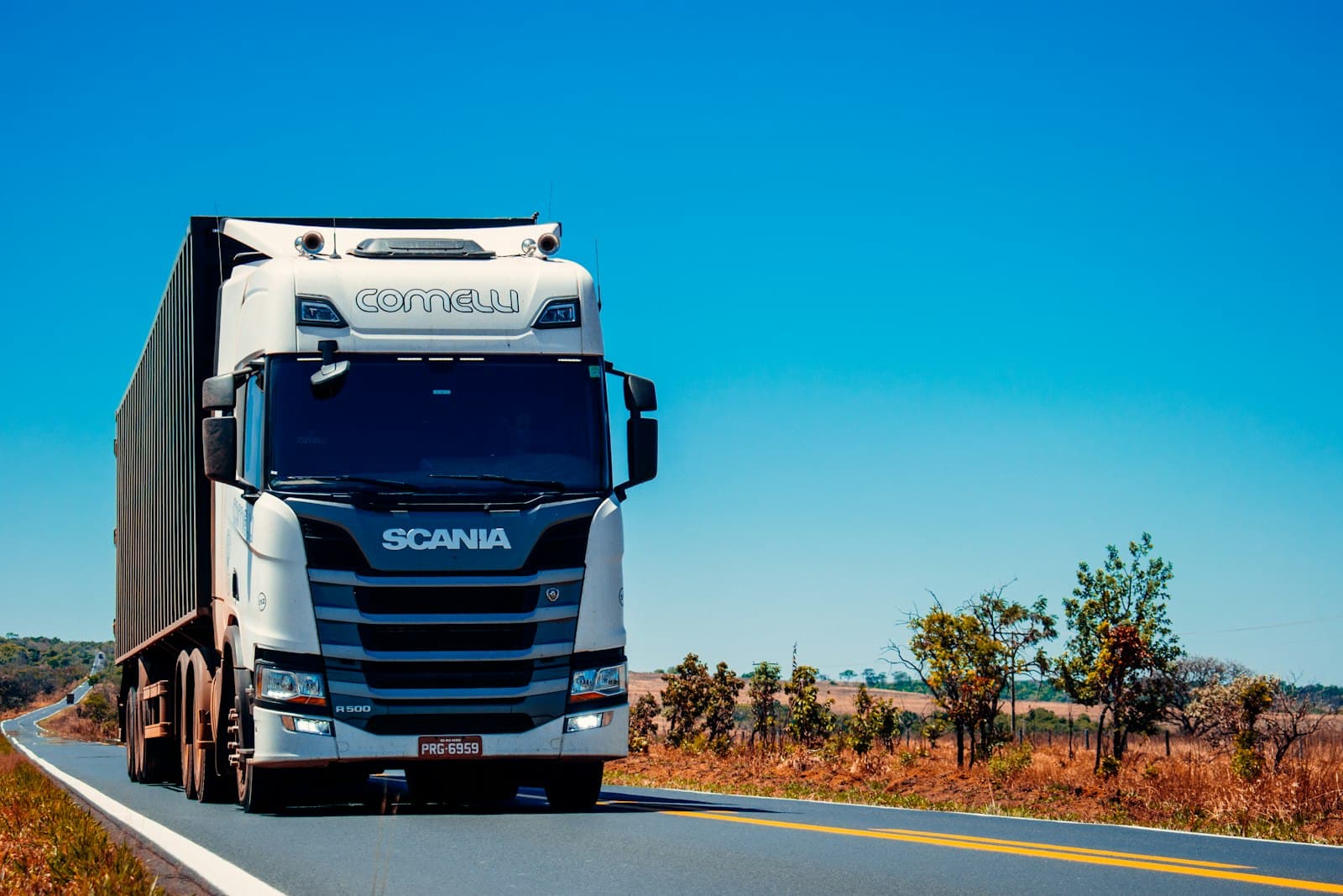 Heavy-duty freight truck on the road, representing specialized cargo transport.